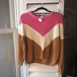 Pink, tan, and white crew neck chevron sweater.